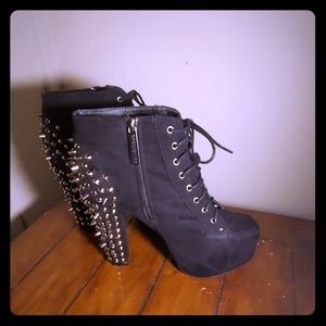 Slightly worn spiked booties